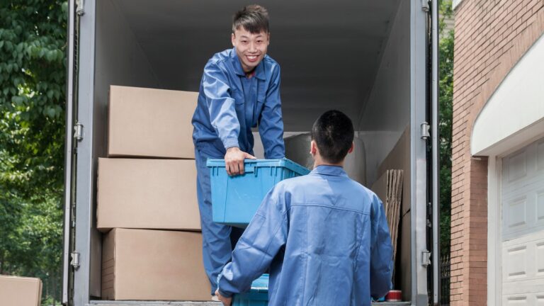 moving-houses-movers-happy-smiling-moving truck-boxes