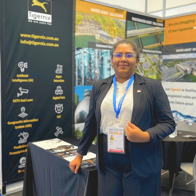 Tigernix Sales and Marketing Manager posing at the Indowater Booth (J09)