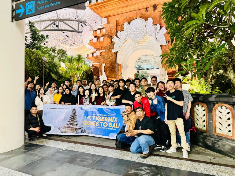 Tigernix Team Posing with Bali Trip Banner